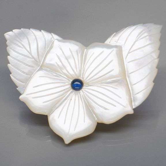 Shimmering 43.06ct flower Mother of Pearl carving with Sapphire