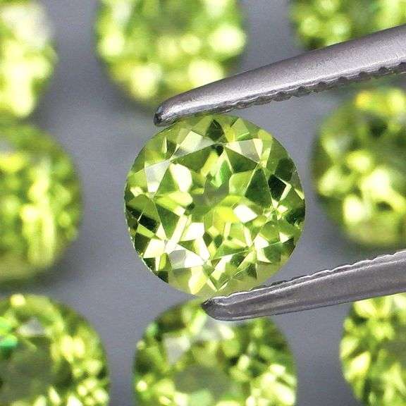 Dazzling 4.98ct untreated apple green Peridot set