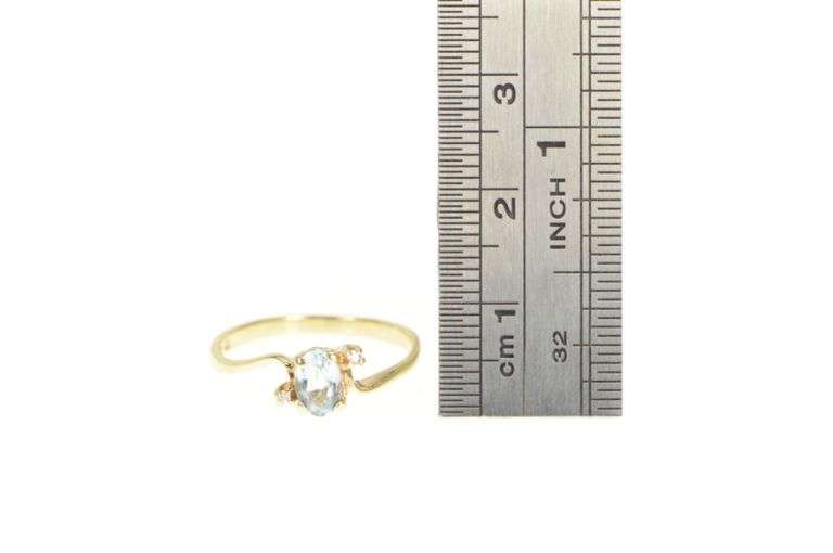 10K Yellow Gold Oval Blue Topaz Diamond Accent Bypass Ring