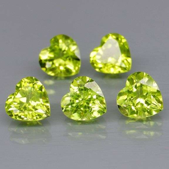 Dazzling 4.13ct untreated apple green Peridot set