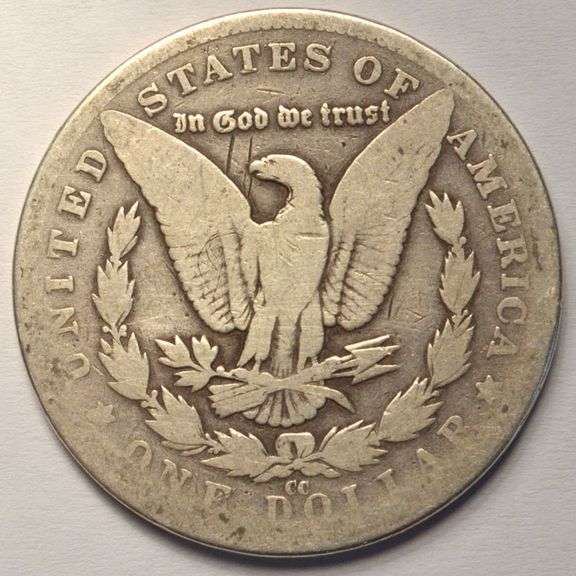 1882-CC Morgan Silver Dollar, Circulated, Damaged.