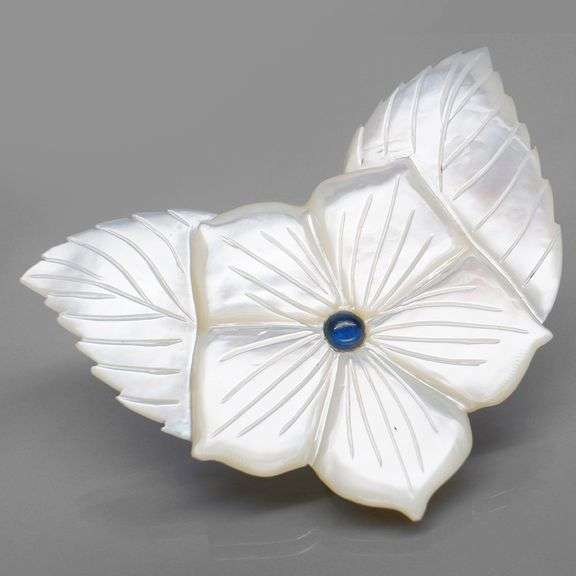Shimmering 43.06ct flower Mother of Pearl carving with Sapphire