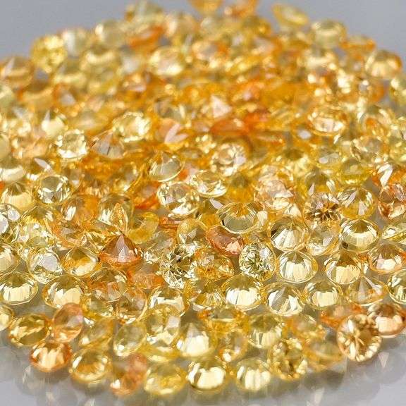 Fantastic 4.71ct diamond cut yellow Sapphire set