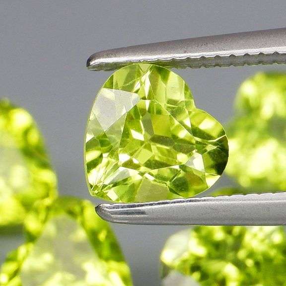 Dazzling 4.13ct untreated apple green Peridot set