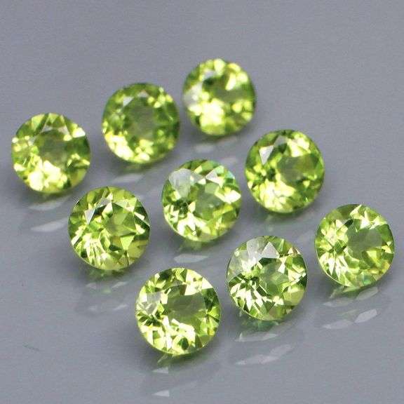 Dazzling 4.98ct untreated apple green Peridot set