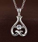 "lets Hug" Sterling Silver with center dancing stone pendant