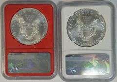 2 NGC MS70 graded 2017 $1 Silver Eagles. 1st Day of Issue