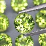 Dazzling 4.98ct untreated apple green Peridot set