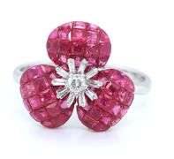 18kt White gold ruby and IRD diamond flower style ring