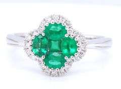 Flower style emerald and diamond ring in 18kt