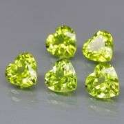 Dazzling 4.13ct untreated apple green Peridot set