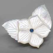 Shimmering 43.06ct flower Mother of Pearl carving with Sapphire
