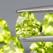 Dazzling 4.13ct untreated apple green Peridot set
