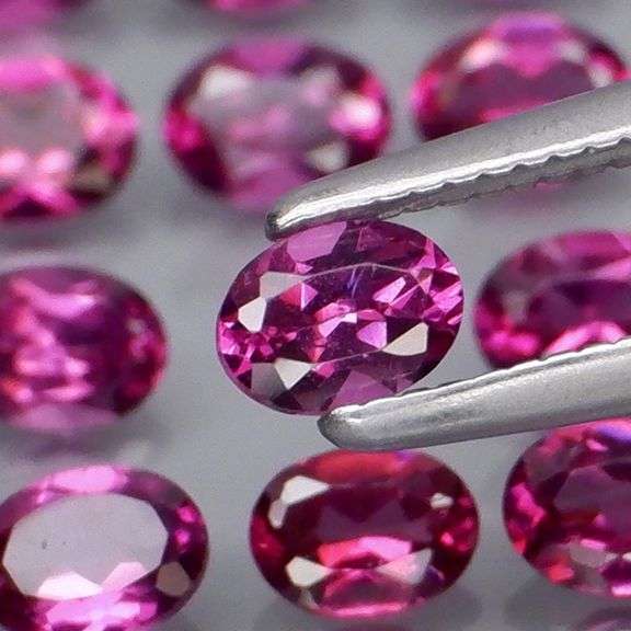 Ravishing 5.72ct violet pink Rhodolite Garnet set