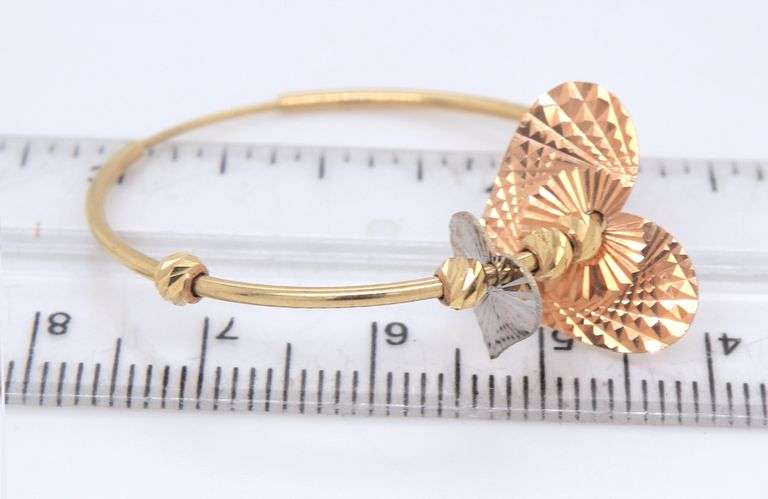 14kt Yellow gold hoop earrings with heart shaped charms