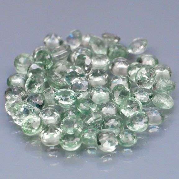 Fantastic 5.09ct diamond cut GREEN Sapphire set