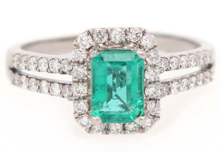 1.00ct Emerald and 0.50ct Diamond Halo Ring in 18K