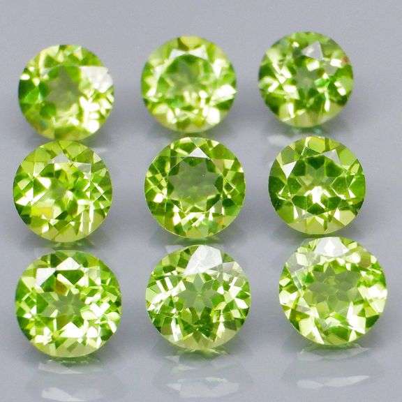 Dazzling 4.91ct untreated apple green Peridot set
