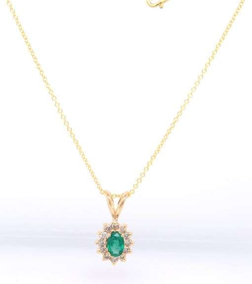 14kt Yellow gold oval Emerald and diamond halo pendant on chain necklace