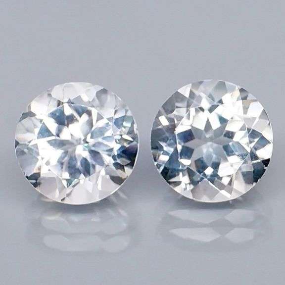 Superb 7.18ct high fire 9mm diamond white Topaz pair