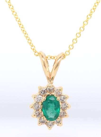 14kt Yellow gold oval Emerald and diamond halo pendant on chain necklace