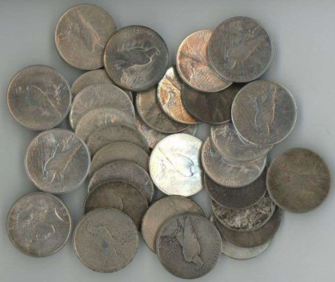 Large lot of 30 assorted Peace Silver Dollars in circ