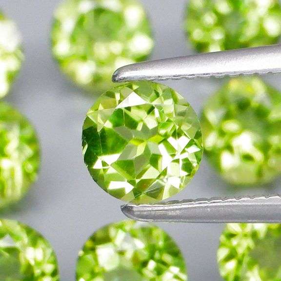 Dazzling 4.91ct untreated apple green Peridot set