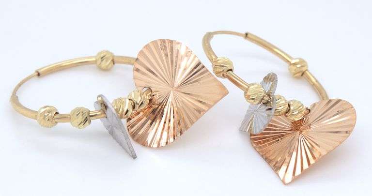 14kt Yellow gold hoop earrings with heart shaped charms