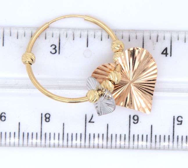 14kt Yellow gold hoop earrings with heart shaped charms