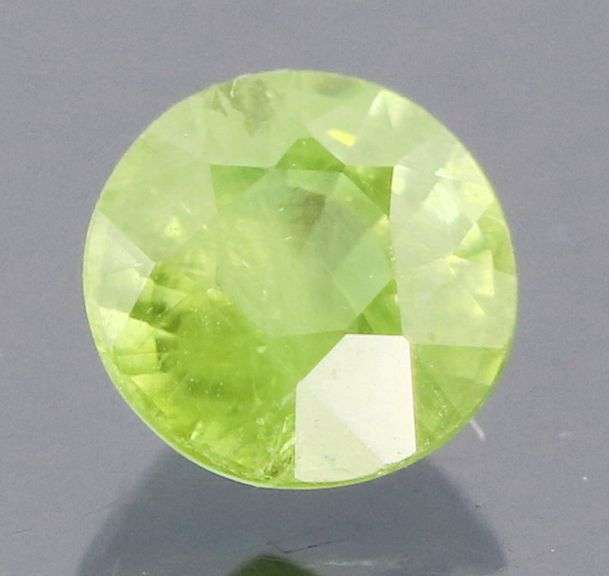 Dazzling .49ct Demantoid Garnet solitaire