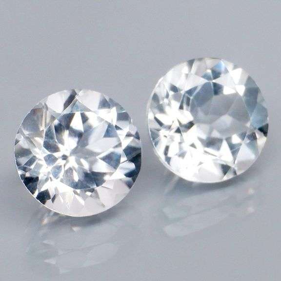 Superb 7.18ct high fire 9mm diamond white Topaz pair