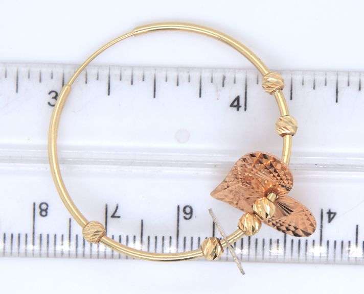 14kt Yellow gold hoop earrings with heart shaped charms