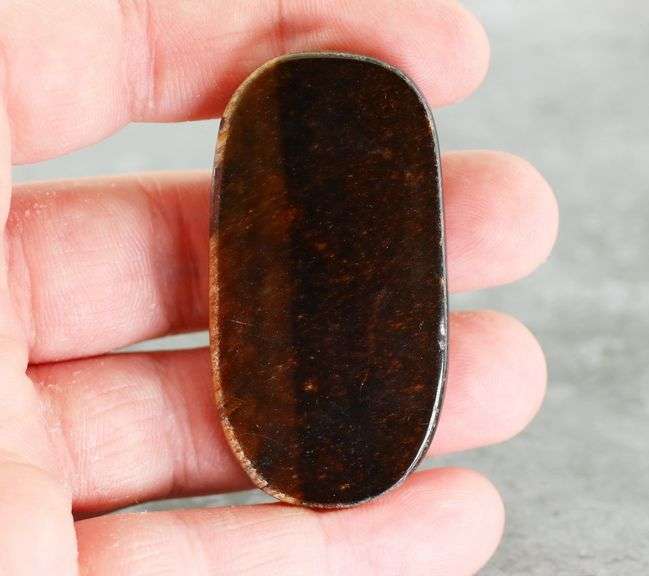 Dramatic 128.44ct Tiger Eye cabochon