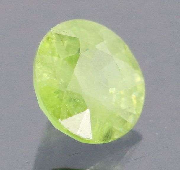 Dazzling .49ct Demantoid Garnet solitaire