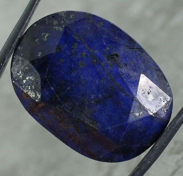 Lavish 70.64ct oval cut ink blue Sapphire