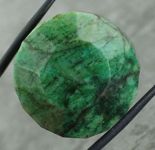 Large 128.40ct forest green Emerald
