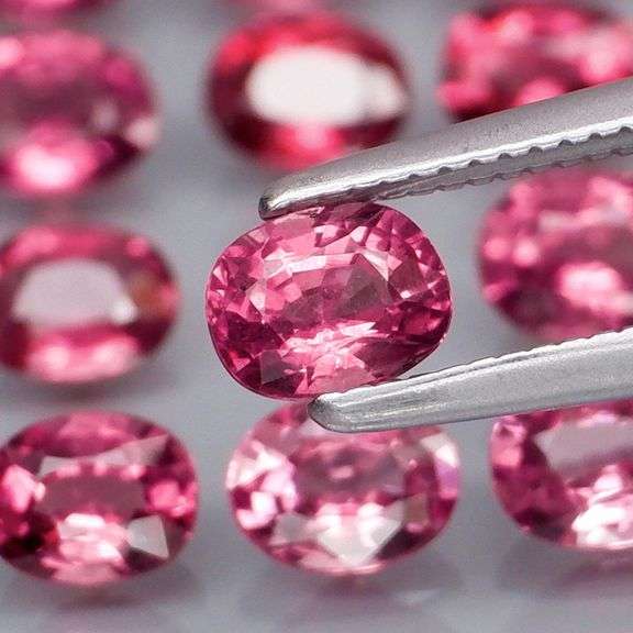 Remarkable 6.44ct reddish pink Rhodolite Garnet set