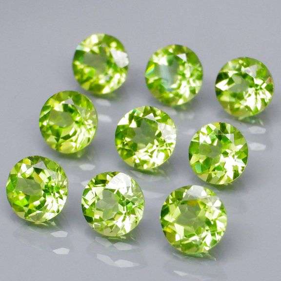 Dazzling 4.91ct untreated apple green Peridot set
