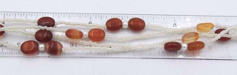 Set of multi row pearl and red agate necklace with matching bracelet and dangle earrings
