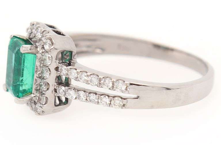 1.00ct Emerald and 0.50ct Diamond Halo Ring in 18K