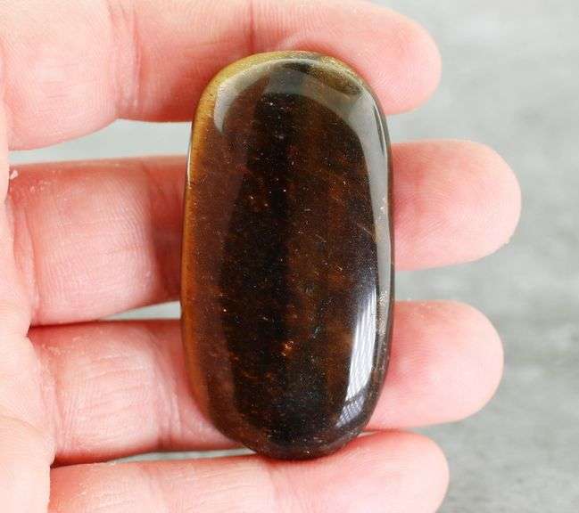 Dramatic 128.44ct Tiger Eye cabochon
