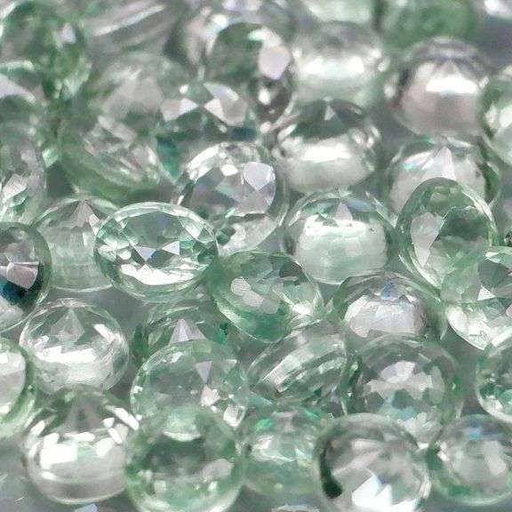 Fantastic 5.09ct diamond cut GREEN Sapphire set