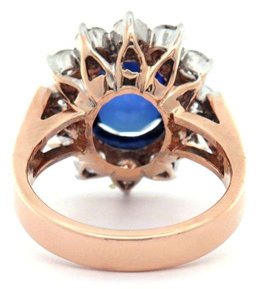 4.49ct Oval Sapphire and 1.50ctw Diamond Starburst Frame Ring in 18K