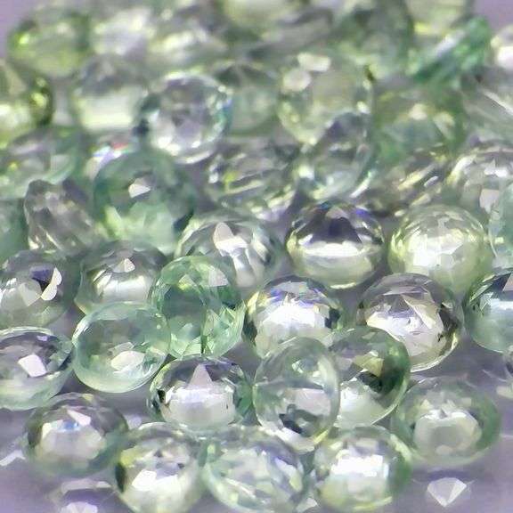 Heated only! 5.43ct round cut green Sapphire set