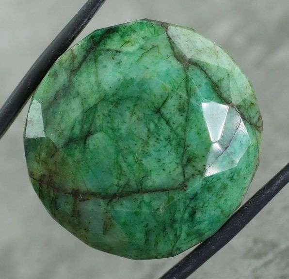 Large 128.40ct forest green Emerald