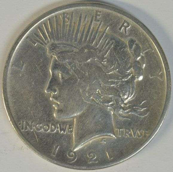 Higher end scarce 1921 Peace Silver Dollar. Cleaned