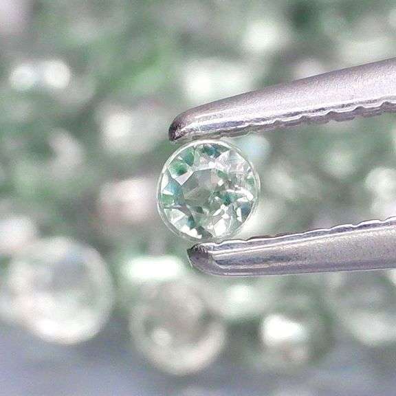 Fantastic 5.09ct diamond cut GREEN Sapphire set
