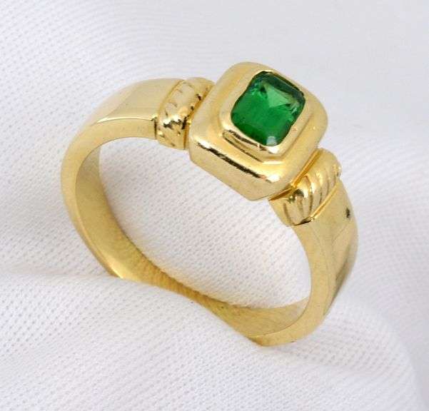 Tasteful Bezel Set Emerald Ring