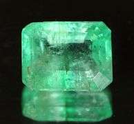 Stunning .65ct bright green Colombian emerald