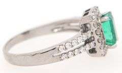1.00ct Emerald and 0.50ct Diamond Halo Ring in 18K
